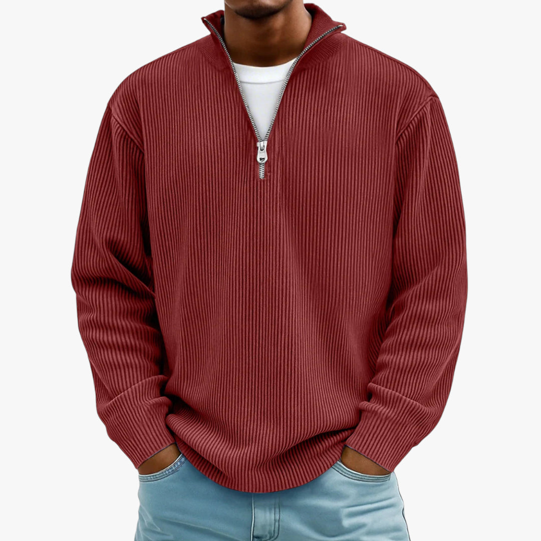 Red ribbed sweater worn by a person on a white background