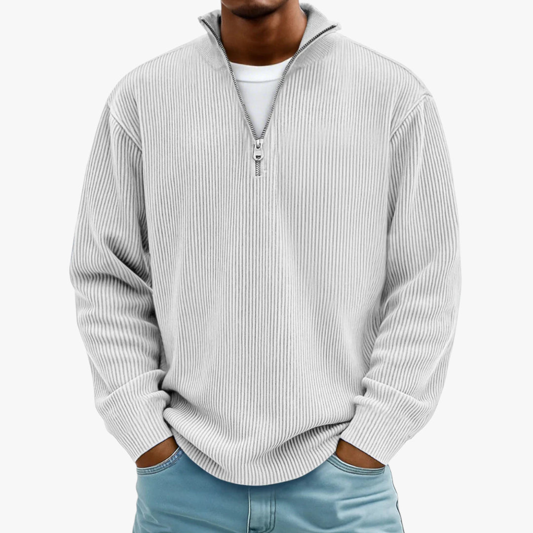 Man wearing a gray ribbed sweater with a zipper on a white background