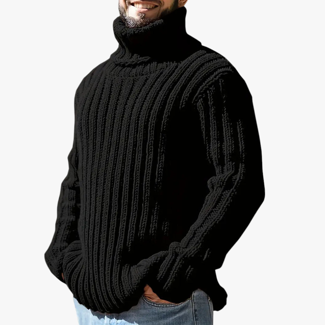 Man wearing a black ribbed sweater on a white background