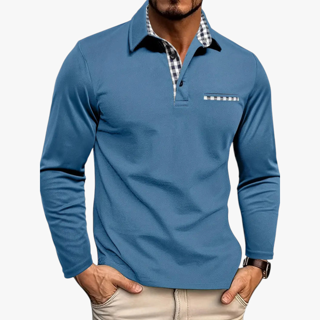 Blue long-sleeve polo shirt with plaid collar and pocket on a white background