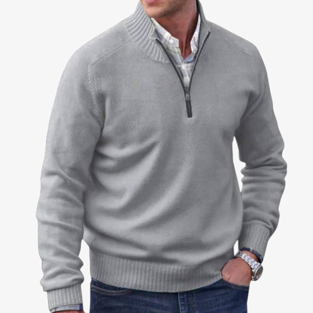 Gray quarter-zip sweater worn by a person on a white background