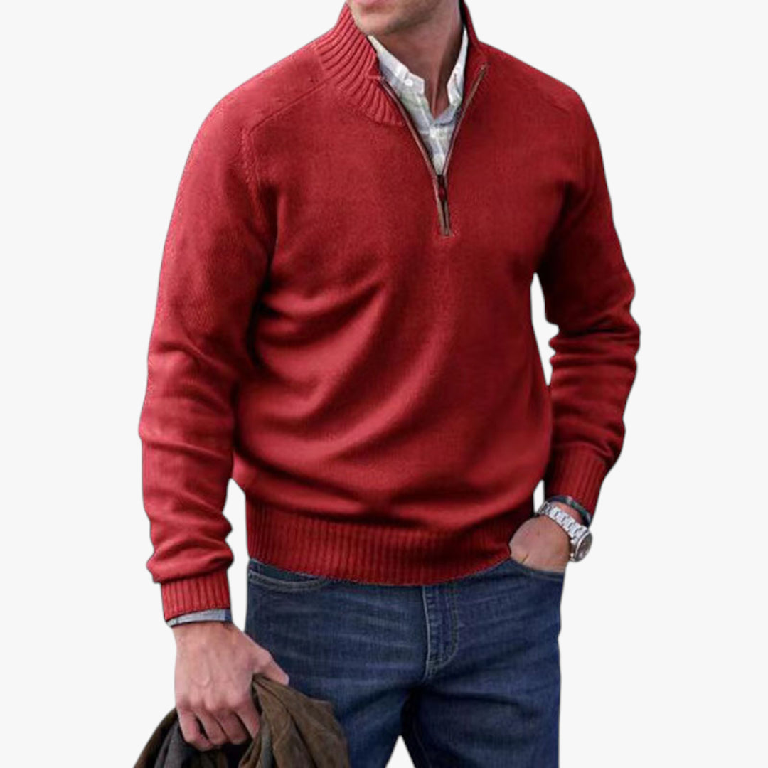 Red sweater with a zipper worn by a person on a white background