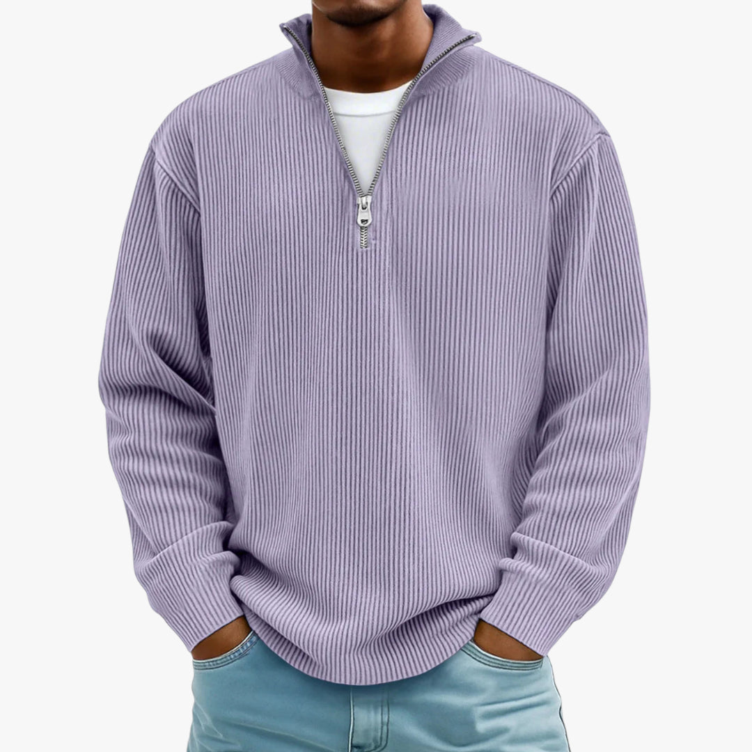 Person wearing a light purple ribbed sweater with a zipper on a white background
