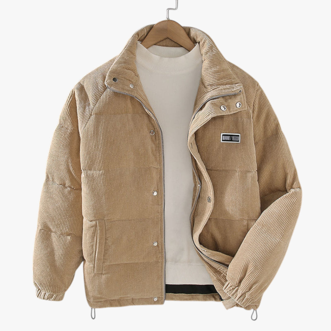 Beige corduroy jacket on a hanger against a white background