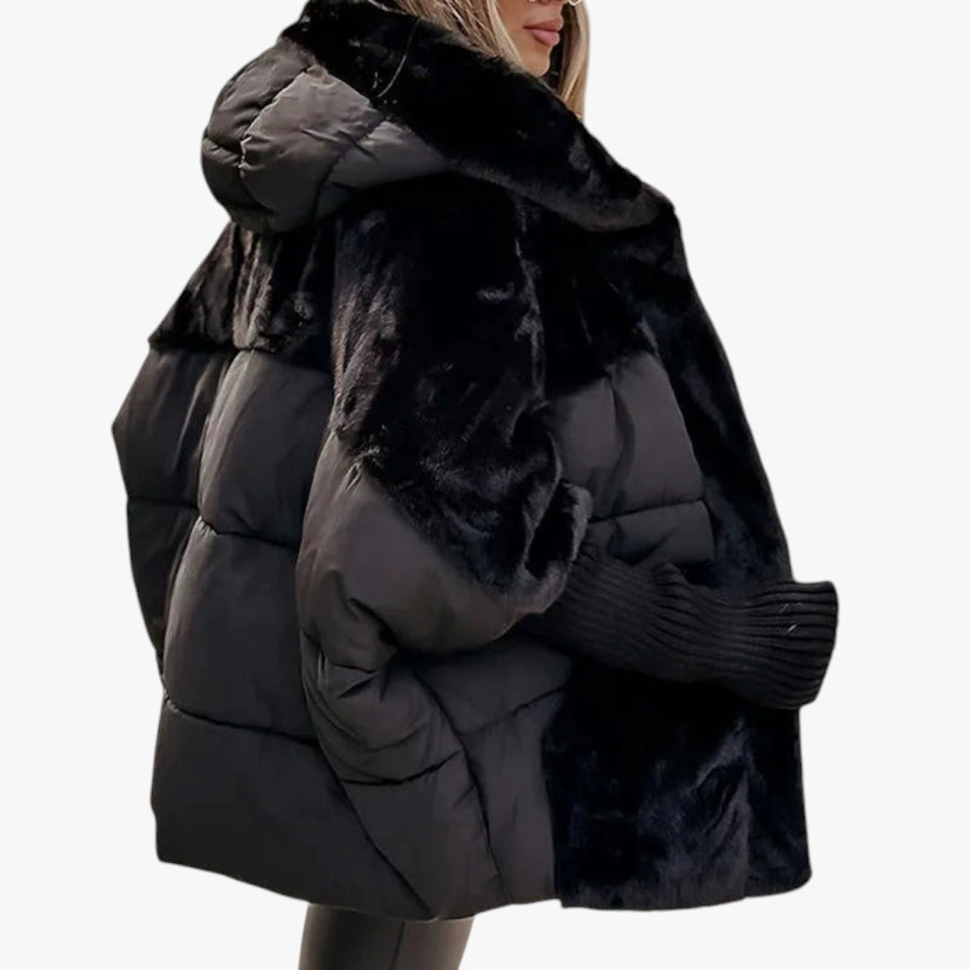 Black puffer jacket with fur trim on a white background