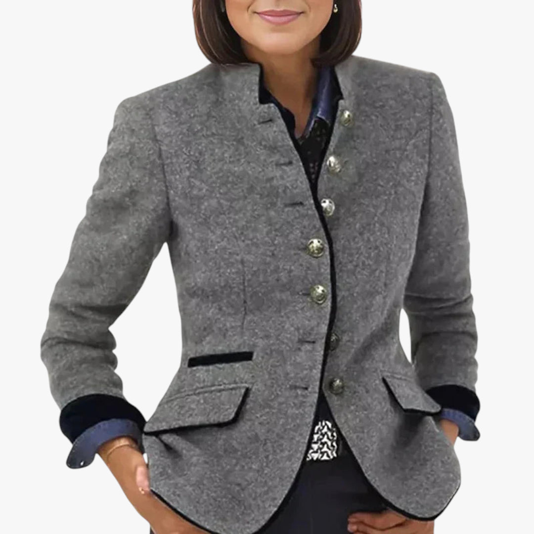 Gray blazer with button details on a plain background